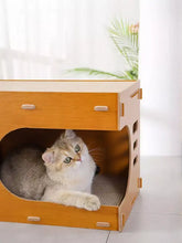 Wooden corrugated paper cat house with curved entrance and scratching surfaces