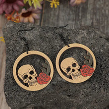 Wooden cutout skeleton earrings with red roses and black accents