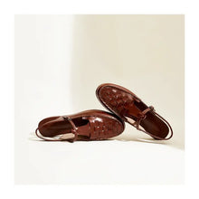 Brown woven leather slingback flats with adjustable buckle