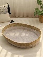 Woven rattan scratch-resistant cat nest with beige interior and tan rope exterior