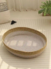 Woven rattan scratch-resistant cat nest with seagrass bed and tan rim