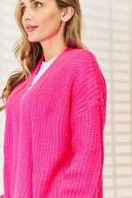 Neon pink drop shoulder cardigan sweater with chunky knit v-neck