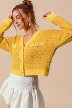 Yellow frayed tweed knit buttoned cardigan with ruffled skirt and pockets