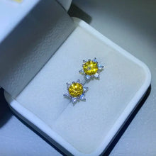 Yellow moissanite sterling silver stud earrings with white stone halo