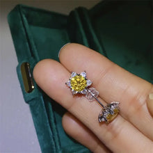 Yellow gemstone sterling silver stud earrings with white stone accents