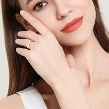 Elegant yellow gold baguette diamond ring with silver inlaid moissanite