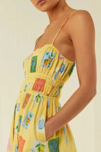 Yellow printed square neck maxi dress with colorful fruit print