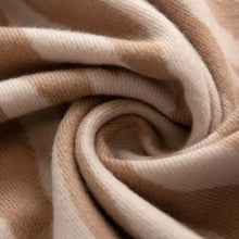 Beige animal print polyester scarf with cashmere-soft plush texture