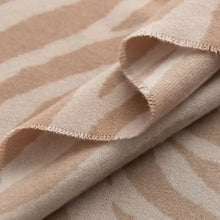 Beige and white animal print polyester scarf with frayed edges