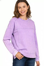 Lavender-colored soft cotton french terry sweatshirt with acid wash and exposed seams in relaxed fit style