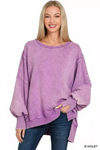 A soft lavender zenana acid washed fleece sweatshirt with acid washed batwing sleeves and ribbed cuffs and hem