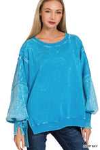 A deep sky blue oversized batwing sleeve fleece sweatshirt with distressed vintage wash and ribbed cuffs and hem