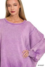A soft lavender zenana acid washed fleece sweatshirt with acid washed batwing sleeves and ribbed cuffs in relaxed fit