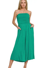 Emerald green strapless jumpsuit with ruched bodice, side pockets, machine wash cold