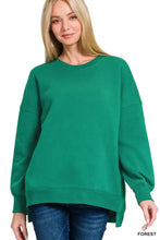 Forest green zenana fleece oversized crewneck sweatshirt with relaxed fit and ribbed cuffs featuring pockets