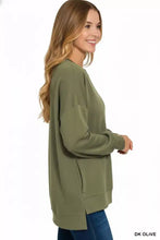 Dark olive zenana fleece hi-low boyfriend sweatshirt with relaxed fit and side pockets pairs well with white sneakers and ankle boots