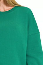 A soft emerald green zenana fleece oversized sweatshirt with relaxed fit and ribbed crew neckline