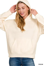 Cream-colored zenana fleece kangaroo hoodie with oversized fit ribbed cuffs and front kangaroo pocket