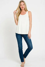 Cream-colored sleeveless tank top with flowy hem made of soft rayon fabric by zenana for comfortable wear