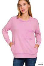 A soft mauve zenana french terry washed raw edge pullover with front pocket and cotton french terry fabric