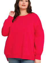 Bright red oversized crewneck boyfriend sweatshirt with fleece material and pockets for plus size pairing advice