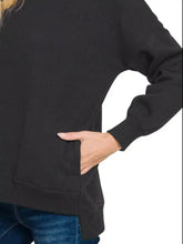 Black oversized Zenana full size fleece hi-low boyfriend sweatshirt with long sleeves and front pocket for best fit and pairing tips