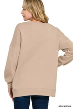 Ash mocha-colored oversized fleece boyfriend sweatshirt with ribbed cuffs and pockets ideal for pairing with ankle boots