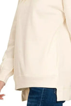 Cream-colored plus size fleece sweatshirt by Zenana with soft cotton, relaxed fit, side slits, and pockets