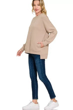 Beige Zenana fleece full size boyfriend sweatshirt with long sleeves and side pockets paired with ankle boots