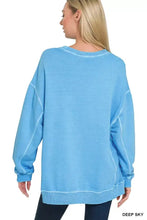 A soft deep sky blue oversized sweatshirt in french terry pigment dye with relaxed fit and ribbed cuffs by zenana