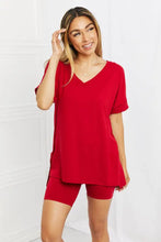 Red v-neck short-sleeved top with relaxed fit and asymmetrical hemline from zenana quiet moments lounge set in burgundy