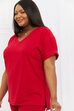 A vibrant red short-sleeved v-neck top with rolled cuffs from zenana full size quiet moments brushed lounge set in burgundy