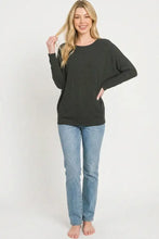 Black hacci dolman sleeve top with relaxed fit and wide sleeves featuring a sleeve boat neck by zenana
