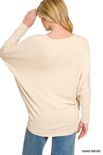 Sand beige Zenana hacci dolman sleeve top with a relaxed fit and round dolman sleeve boat neckline