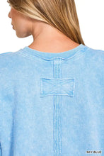 Sky blue vintage wash distressed cotton sweatshirt with central cross-stitched patch and ribbed neckline by Zenana