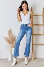 High-waisted blue denim flare jeans paired with a zenana microfiber notched sleeveless bodysuit in classic wash