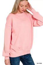 A soft dusty pink zenana pigment dye oversized sweatshirt with ribbed cuffs and hem in fleece material
