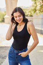 Black sleeveless zenana racerback tank bodysuit with scoop neckline and fitted silhouette for versatile layering