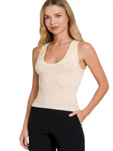 Cream-colored ribbed seamless crop tank top with scoop neckline made of ribbed knit fabric by Zenana