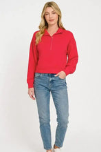 Red Zenana scuba half zip pullover with long sleeves, ribbed hem, and kangaroo pockets made of soft fabric