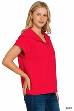 A vibrant red zenana scuba half zip short-sleeved top with collar and slightly stretchy scuba fabric