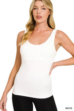 White seamless cami tank top with built in bra featuring a scoop neckline and smooth, form-fitting fabric