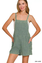 Sage green textured woven overalls with thin straps and side pockets