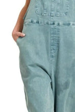 Zenana washed knot strap relaxed fit light blue denim overalls with hand in pocket