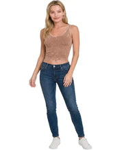 A taupe velvet zenana washed ribbed seamless cropped v-neck tank top with a subtle textured pattern