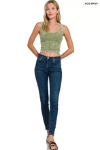 A pair of dark blue acid-wash high-rise skinny jeans paired with a zenana washed ribbed seamless cropped tank top