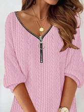 Pink cable-knit mini sweater with black front zipper detail