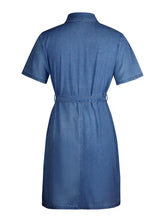 Blue denim dress with zip front short sleeve and belted waist featuring a stylish short sleeve denim design