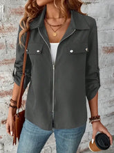 Olive green zip-up jacket with collared neck roll-tab sleeve and pocket details