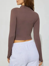 Brown ribbed long-sleeve active outerwear with high neckline